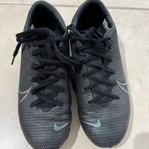 Nike Mercurial-Boy’s Black Soccer cleats with Iridescent Swoosh